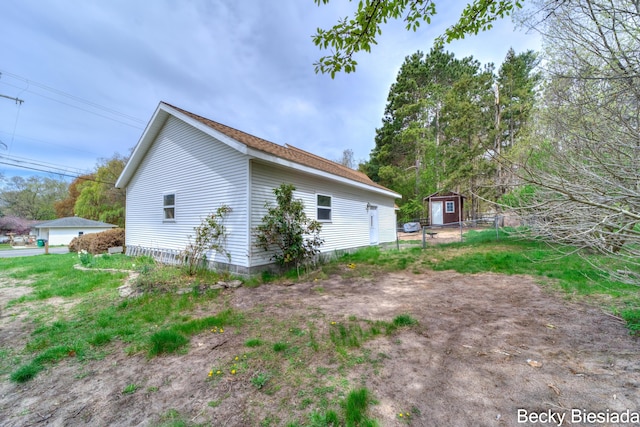 823 Warner St, Whitehall, MI 49461 - view of home's exterior with an outdoor structure