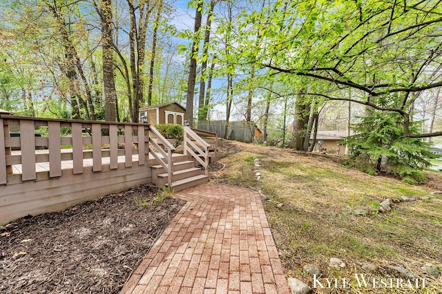 view of yard with fence and an outdoor structure