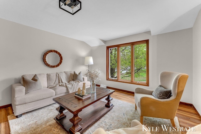 living room featuring baseboards and wood finished floors