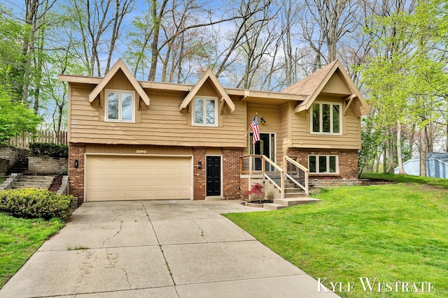 raised ranch with brick siding, a garage, a front lawn, and concrete driveway