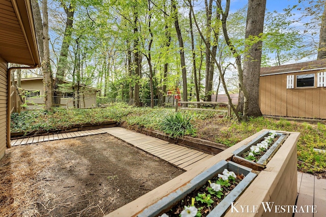 fenced yard with a vegetable garden