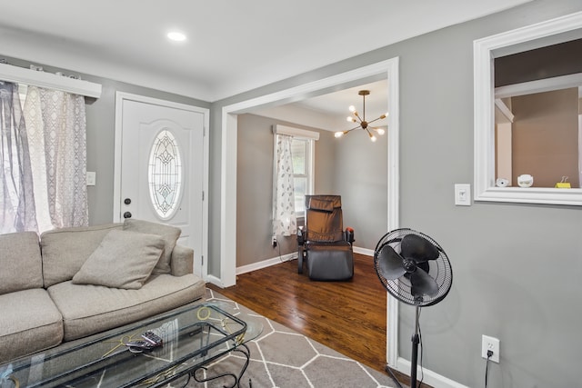 living room featuring dark wood-style floors, baseboards, a chandelier, and recessed lighting