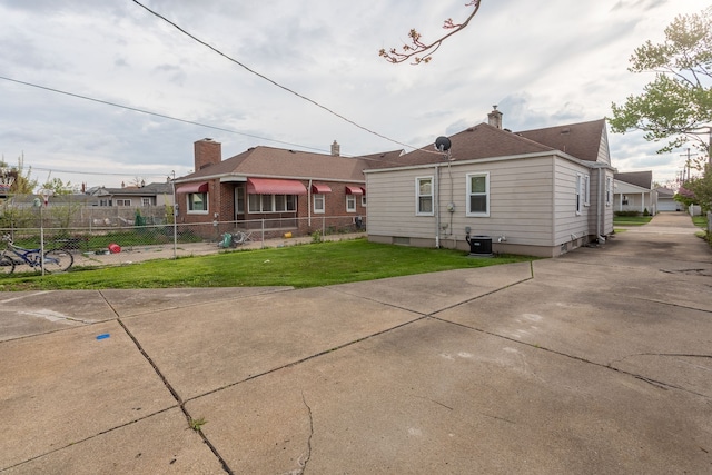 rear view of house with cooling unit