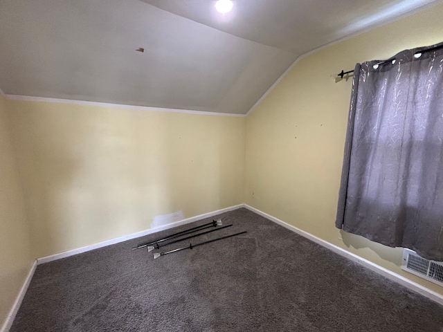 17233 Fenelon St, Hamtramck, MI 48212 - additional living space with vaulted ceiling, baseboards, and carpet floors