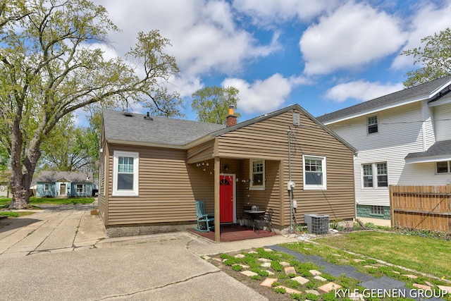 188 W 21st St, Holland, MI 49423 - view of front facade featuring a chimney and cooling unit
