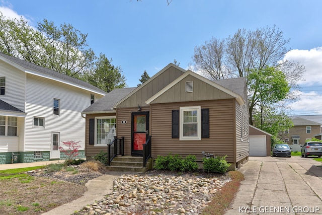 188 W 21st St, Holland, MI 49423 - bungalow-style house with board and batten siding, a garage, and roof with shingles