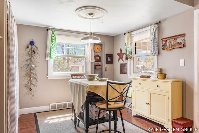 188 W 21st St, Holland, MI 49423 - dining room featuring wood finished floors and baseboards