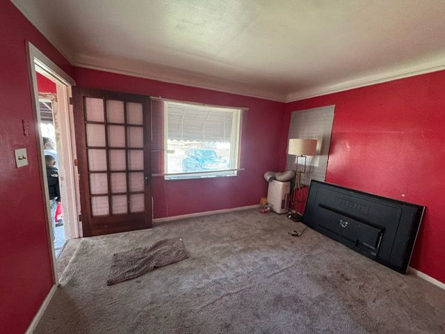 14611 Washburn St, Detroit, MI 48238 - carpeted spare room with baseboards