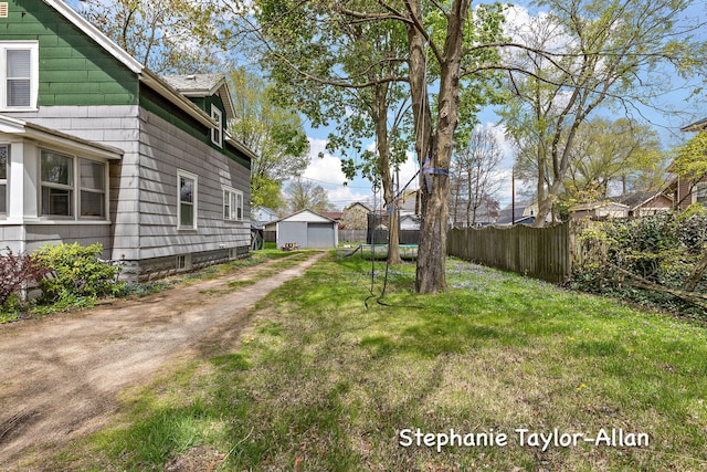 view of yard with dirt driveway