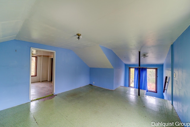 additional living space with lofted ceiling
