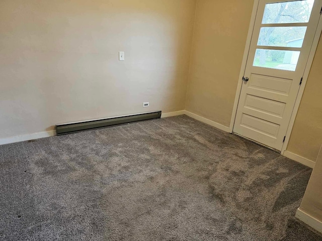 335 Emory St, Howard City, MI 49329 - empty room with a baseboard radiator, carpet flooring, and baseboards
