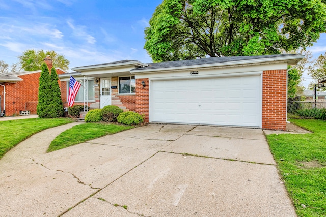 24719 Audrey Ave, Warren, MI 48091 - view of front of house featuring brick siding, driveway, and a garage