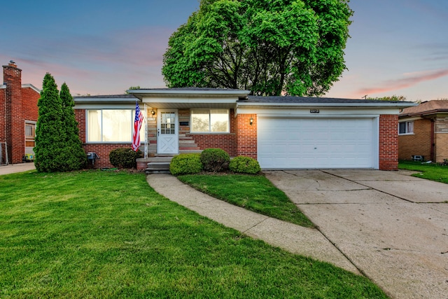 24719 Audrey Ave, Warren, MI 48091 - ranch-style home with an attached garage, brick siding, driveway, and a lawn