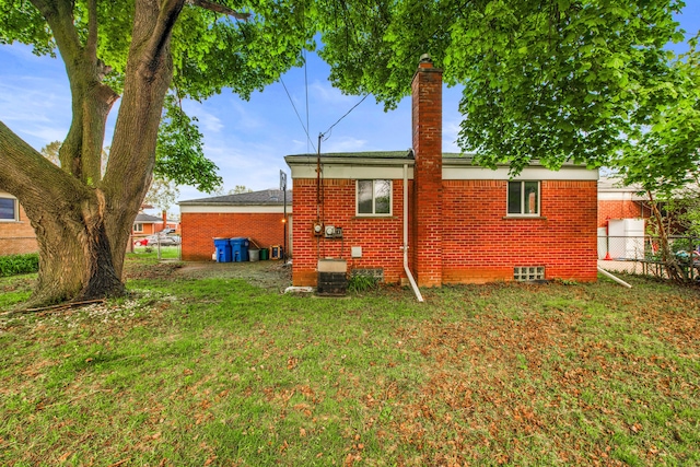 24719 Audrey Ave, Warren, MI 48091 - back of house with brick siding and a chimney