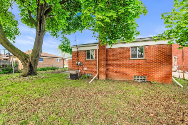 24719 Audrey Ave, Warren, MI 48091 - back of house featuring brick siding and central air condition unit