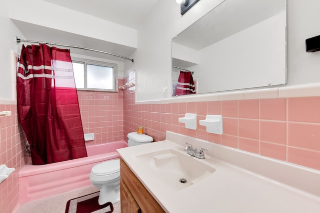 24719 Audrey Ave, Warren, MI 48091 - bathroom with tile walls, toilet, shower / bathtub combination with curtain, vanity, and a wainscoted wall