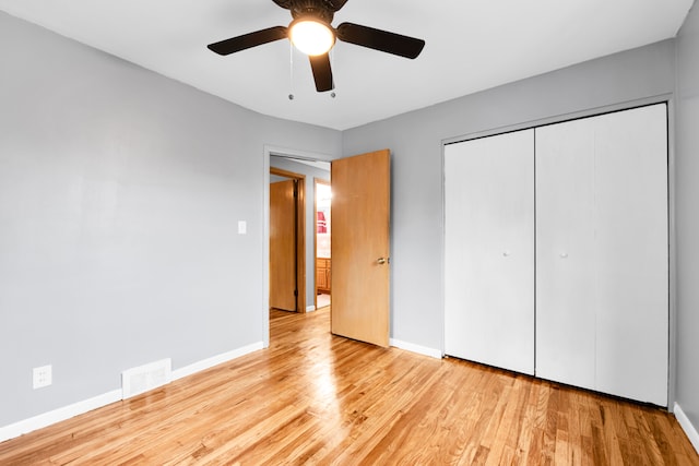 24719 Audrey Ave, Warren, MI 48091 - unfurnished bedroom with wood finished floors, baseboards, a closet, and a ceiling fan