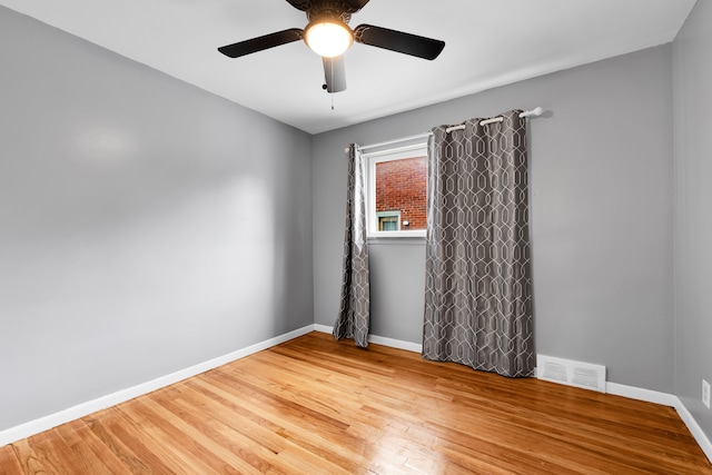 24719 Audrey Ave, Warren, MI 48091 - empty room featuring wood finished floors, a ceiling fan, and baseboards
