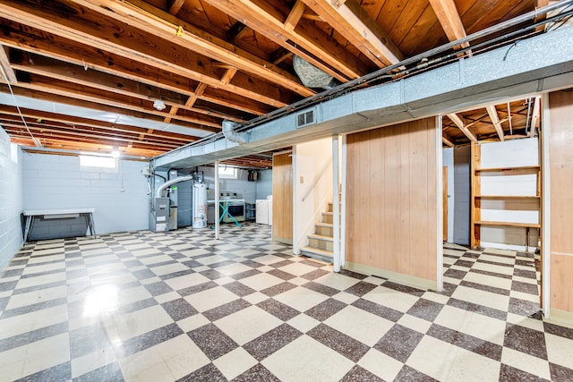24719 Audrey Ave, Warren, MI 48091 - basement with washing machine and clothes dryer, tile patterned floors, gas water heater, stairway, and concrete block wall