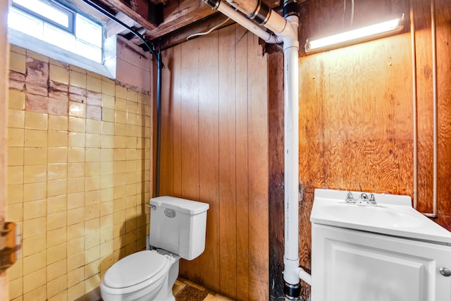 24719 Audrey Ave, Warren, MI 48091 - bathroom featuring toilet, wooden walls, and vanity