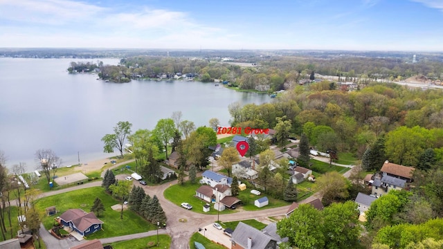view of property location with a large body of water and nearby suburban area