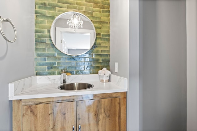 bathroom with vanity and tasteful backsplash
