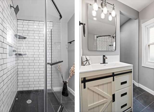 full bathroom with a shower stall, tile patterned flooring, vanity, and baseboards