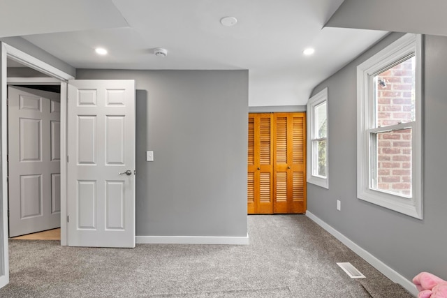 unfurnished bedroom with carpet floors, baseboards, and recessed lighting