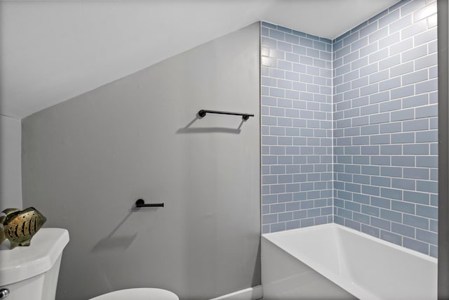 bathroom with toilet and bathing tub / shower combination