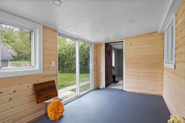 unfurnished sunroom with plenty of natural light