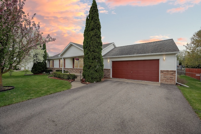 9361 Summerland Dr, Whitmore Lake, MI 48189 - view of front of property featuring brick siding, driveway, and a garage