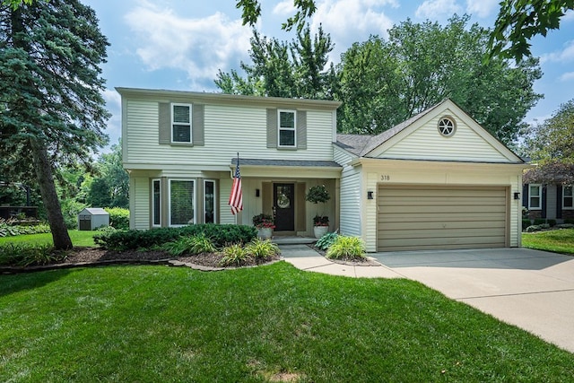 318 Arlington Dr, Rochester Hills, MI 48307 - traditional-style house with a garage, concrete driveway, and a front yard