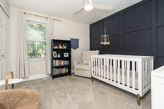 318 Arlington Dr, Rochester Hills, MI 48307 - bedroom with light carpet, a nursery area, baseboards, and a ceiling fan