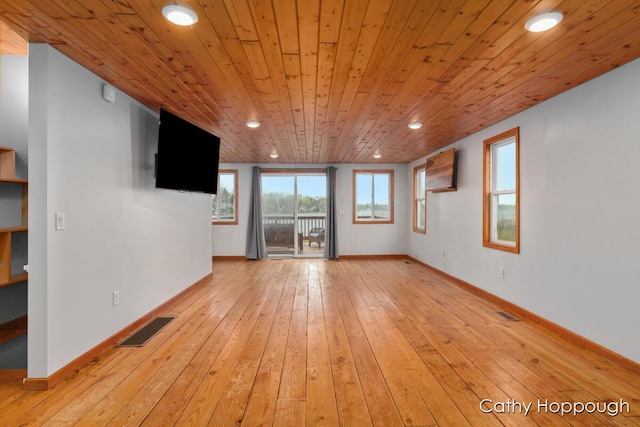 unfurnished living room featuring light wood-style flooring, recessed lighting, baseboards, and wood ceiling
