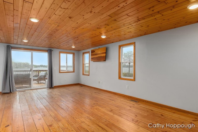 unfurnished room featuring recessed lighting, wood-type flooring, healthy amount of natural light, wood ceiling, and baseboards