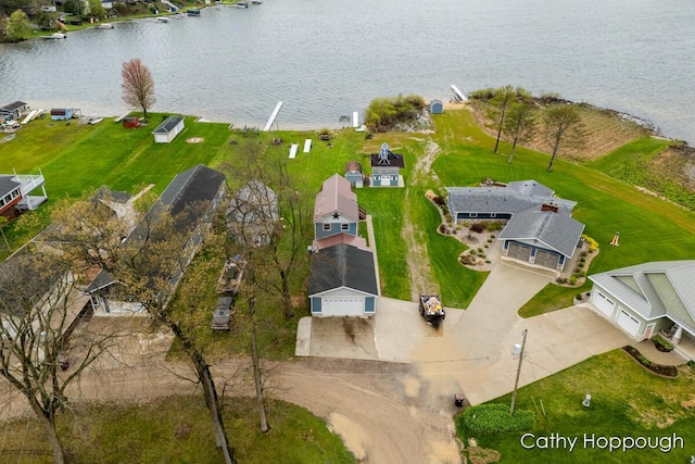 aerial view of residential area featuring a nearby body of water