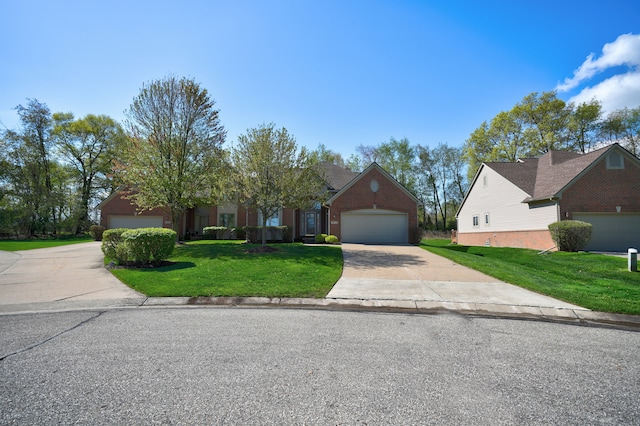 view of front of house featuring a front yard, driveway, and a garage