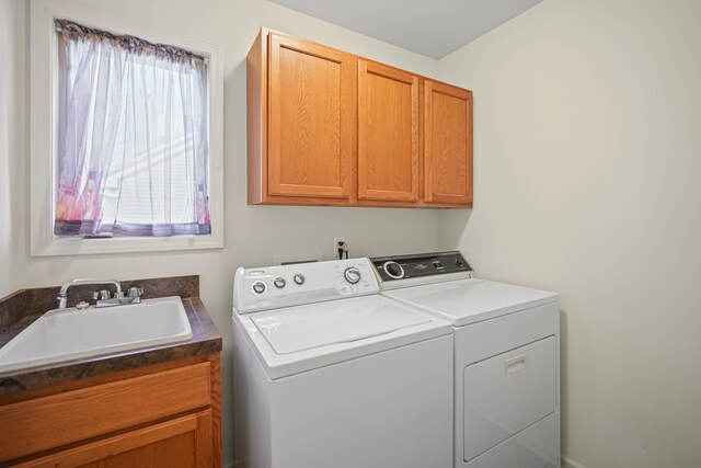 laundry room with cabinet space and washer and dryer