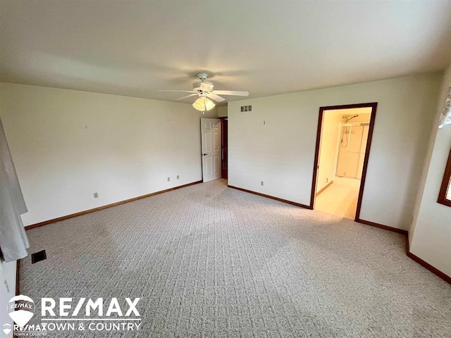 unfurnished room with carpet flooring, ceiling fan, and baseboards