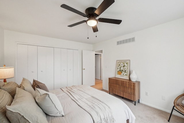 4630 Pasture Ln, White Lake, MI 48383 - bedroom with a closet, light colored carpet, baseboards, and ceiling fan