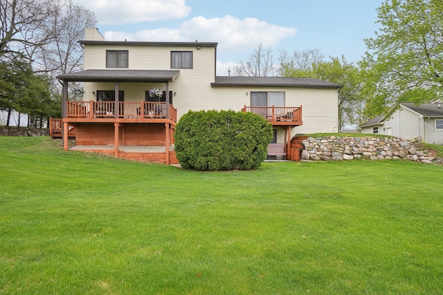 4630 Pasture Ln, White Lake, MI 48383 - back of house with a chimney, a deck, a yard, and a shingled roof