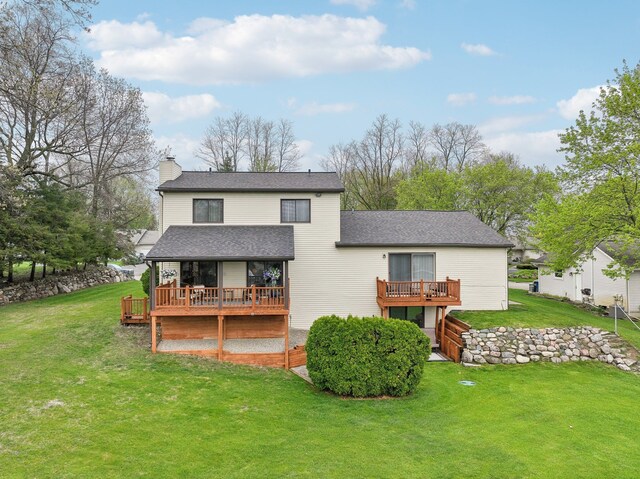 4630 Pasture Ln, White Lake, MI 48383 - back of house with a deck, a chimney, a yard, and a shingled roof