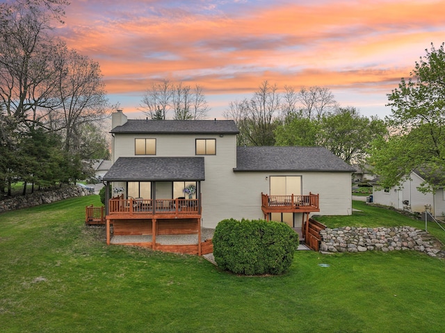 4630 Pasture Ln, White Lake, MI 48383 - back of house at dusk featuring a wooden deck, a lawn, a chimney, and roof with shingles