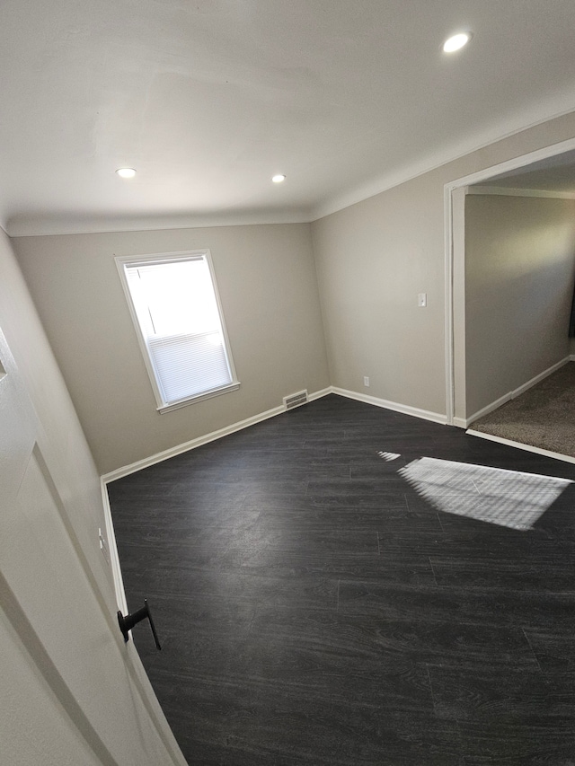 unfurnished bedroom featuring recessed lighting, dark wood finished floors, and baseboards