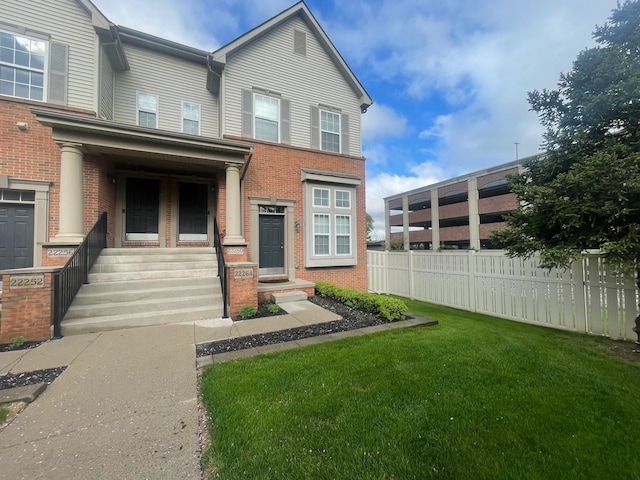 view of front facade featuring brick siding