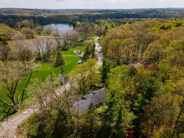 aerial view of a heavily wooded area and a large body of water