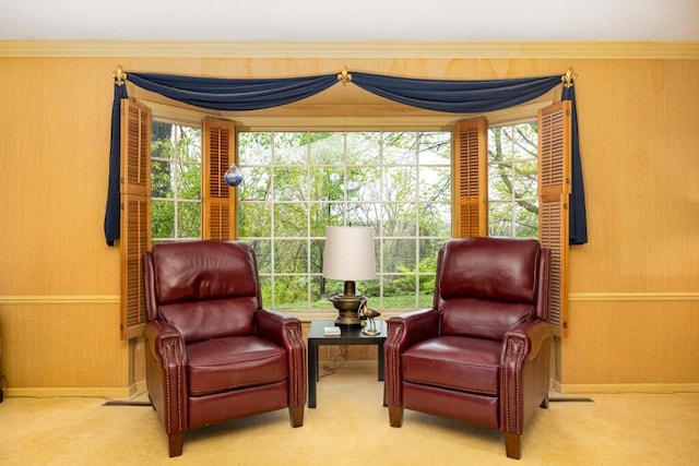 sitting room with carpet, wallpapered walls, and baseboards