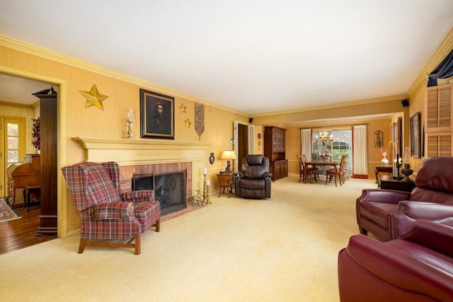 living area with plenty of natural light, crown molding, a fireplace, a chandelier, and carpet flooring