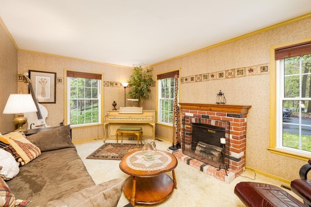 living room featuring wallpapered walls, ornamental molding, healthy amount of natural light, baseboards, and a fireplace