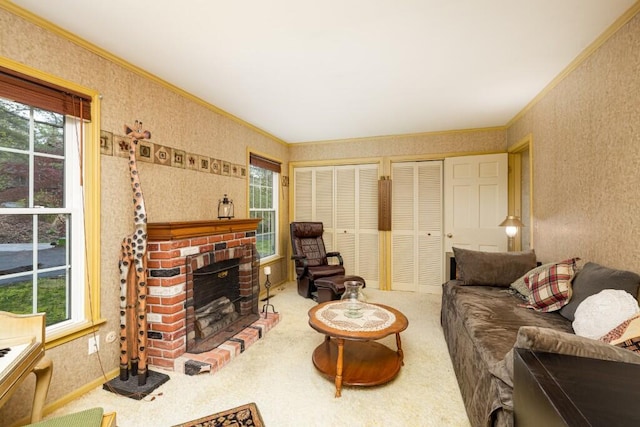 carpeted living room with crown molding, healthy amount of natural light, wallpapered walls, and a fireplace